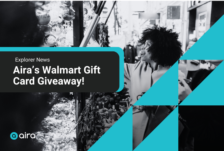 A woman reaching up to examine a display of holiday decorations at a market stall. White text on a black backgrounds reads "Explorer News: Aira's Walmart Gift Card Giveaway." At right, decorative teal triangles. At bottom left, Aira logo.