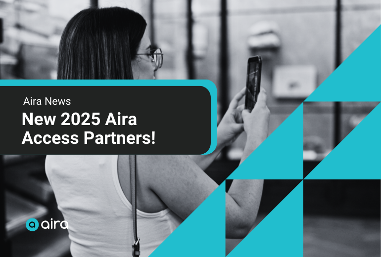 A woman in a museum exhibit hall holds up her cell phone. She has brown hair, wears a white tank top, and carries a purse. "Aira News: New 2025 Aira Access Partners." Teal decorative triangles at right, and Aira logo at left.